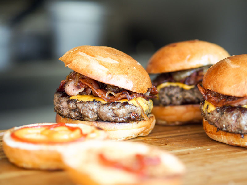 juicy burgers on a cutting board