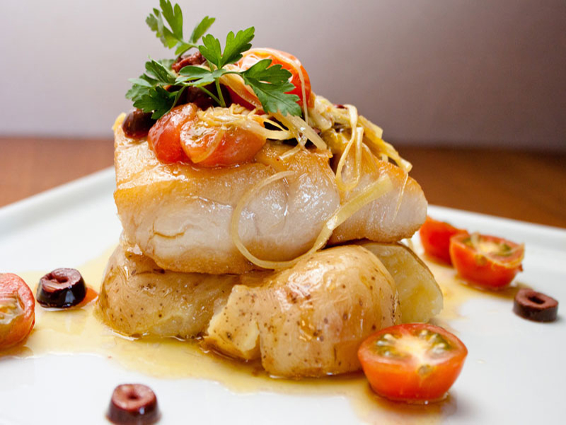 baked fish with potatoes and cherry tomatoes